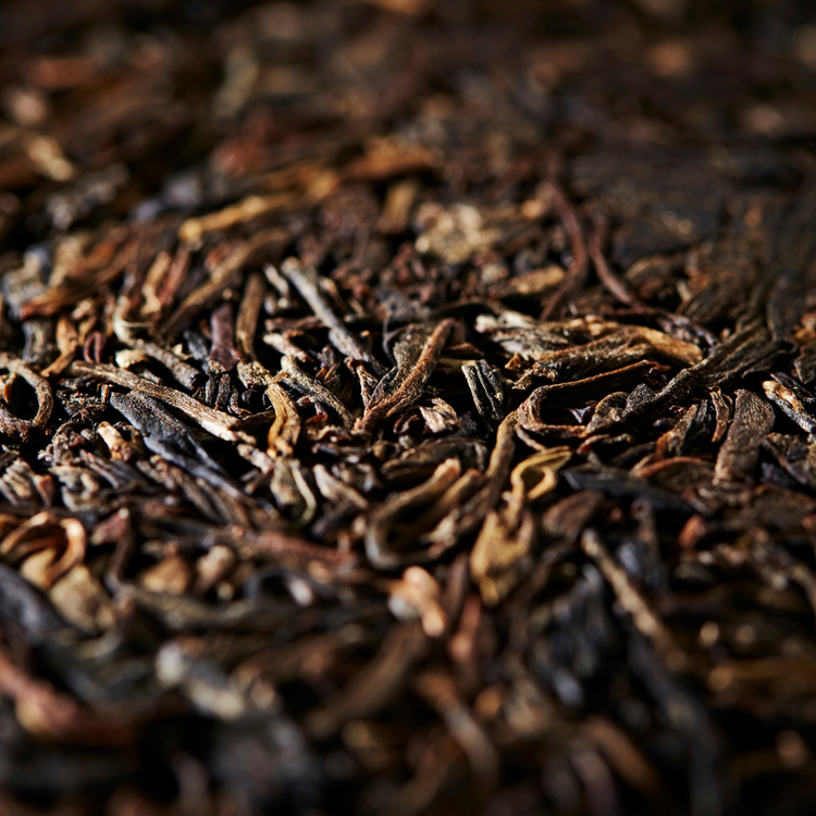 Loose leaf Pu-Erh Tea – dark fermented Yunnan tea leaves with rich earthy aroma and smooth taste