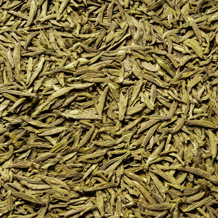 “Loose leaf Lung Ching Dragon Well Green Tea – flat, jade-green leaves with fresh grassy aroma and smooth chestnut flavor
