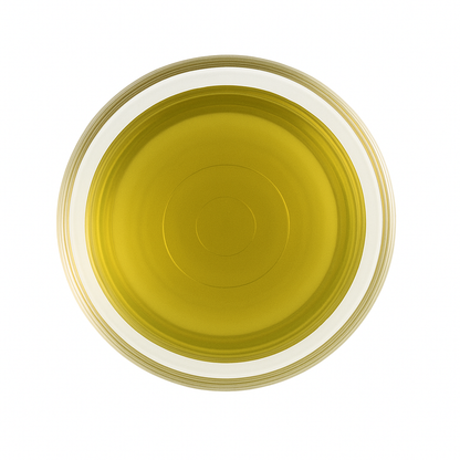 Top view of a glass cup filled with golden 888 King’s Oolong Tea