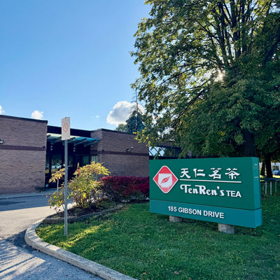 Ten Ren's Tea sign at 185 Gibson Drive in front of a brick building