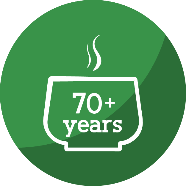 Green circular badge with a white outline of a steaming cup and the text 70 plus years